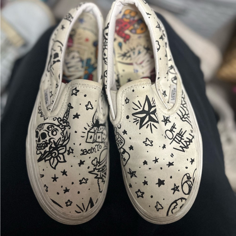 Vans Cream Slip-On Shoes with Black Graphics
